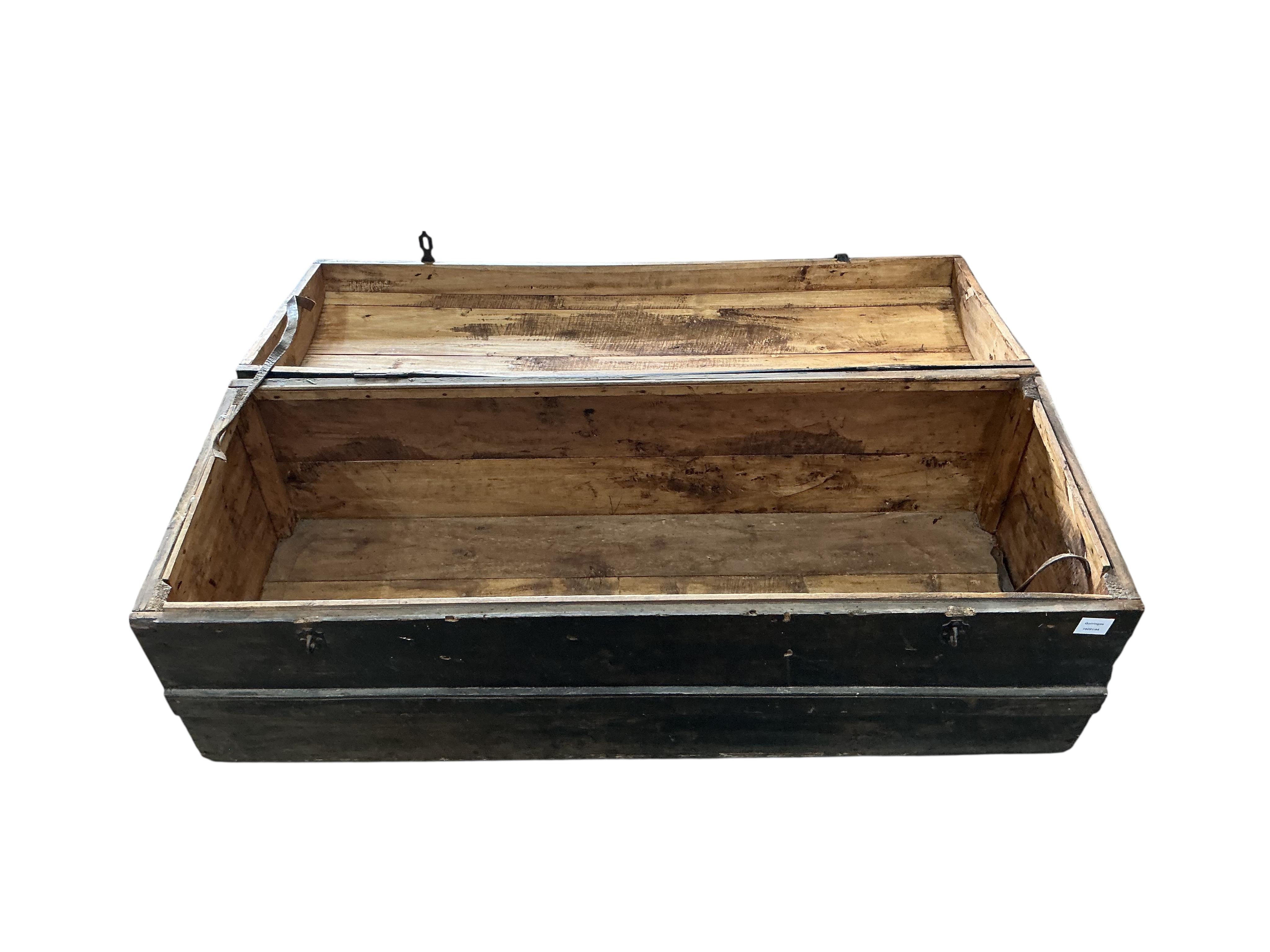 A stained pine domed top trunk, width 123cm, depth 46cm, height 47cm